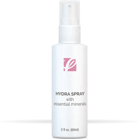 bottle of private labeled Hydra Spray with Essential Minerals sitting on table