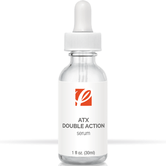 bottle of private labeled ATX Double Action Serum sitting on table