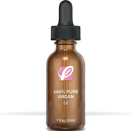 bottle of private labeled 100% Pure Argan Oil sitting on table